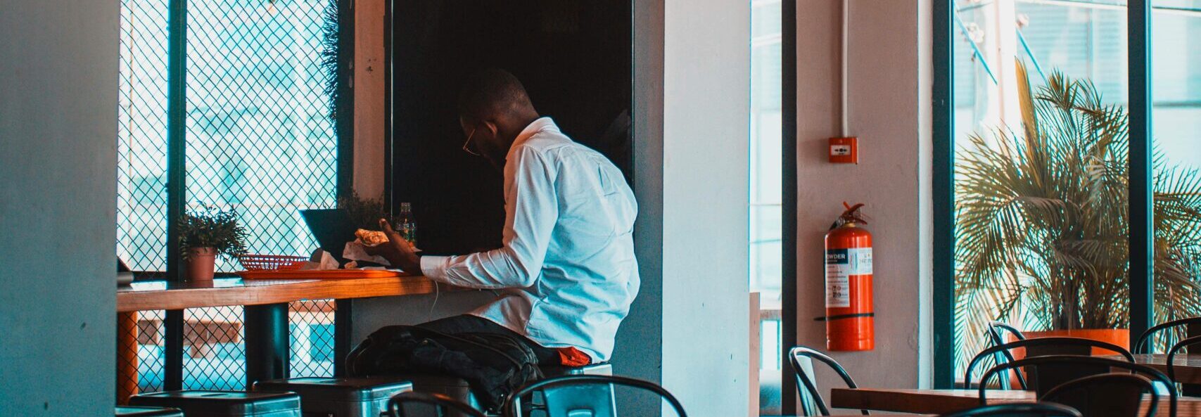 Warm and inviting café setting in Accra, featuring unique hanging lights and stylish decor.